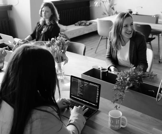 three women working at an office